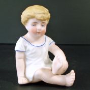 German Bisque Sitting Piano Baby Figurine 3 Inches
